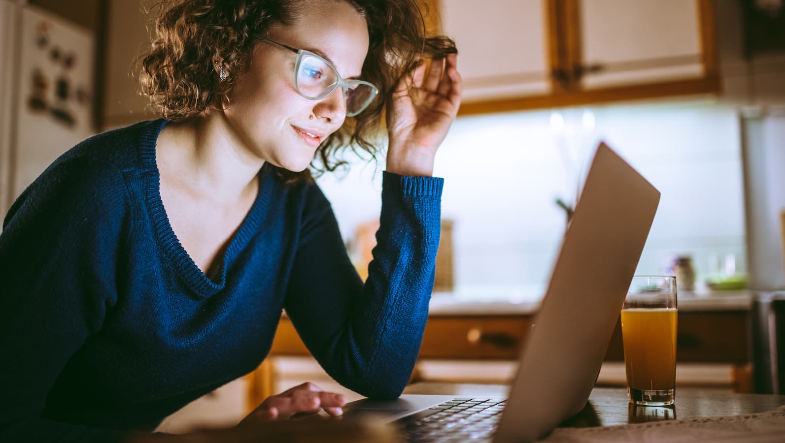 Woman on her laptop at home