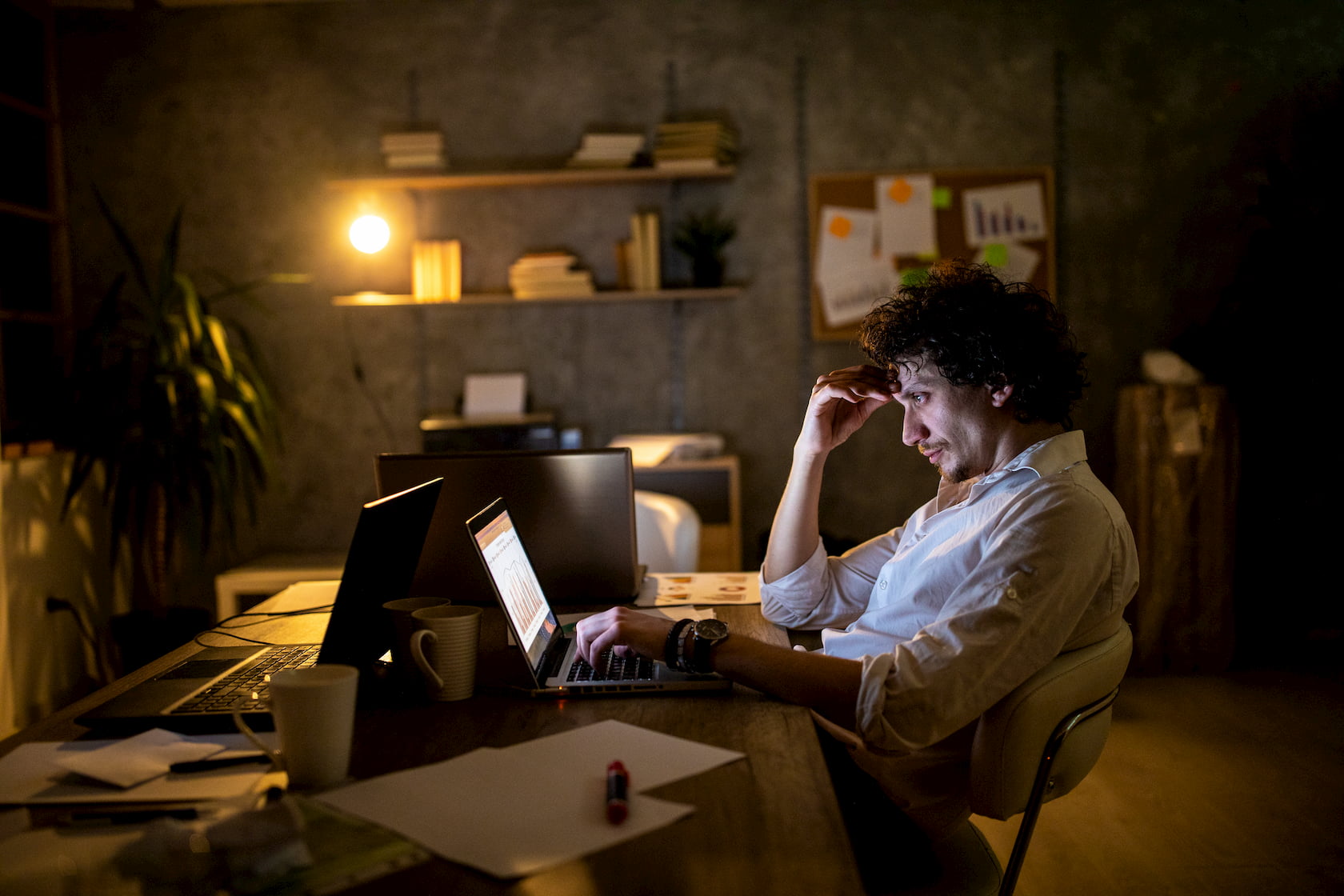 A frustrated man sitting at his computer