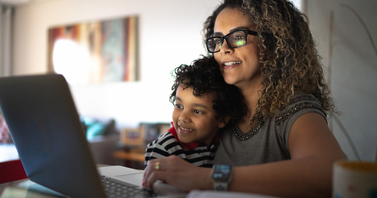 A woman and her child using a laptop