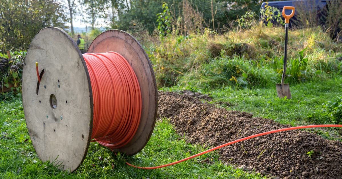 spool of fiber cable in a backyard