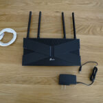 The TP-Link Archer AX20 ships with an Ethernet cable and a power adapter.