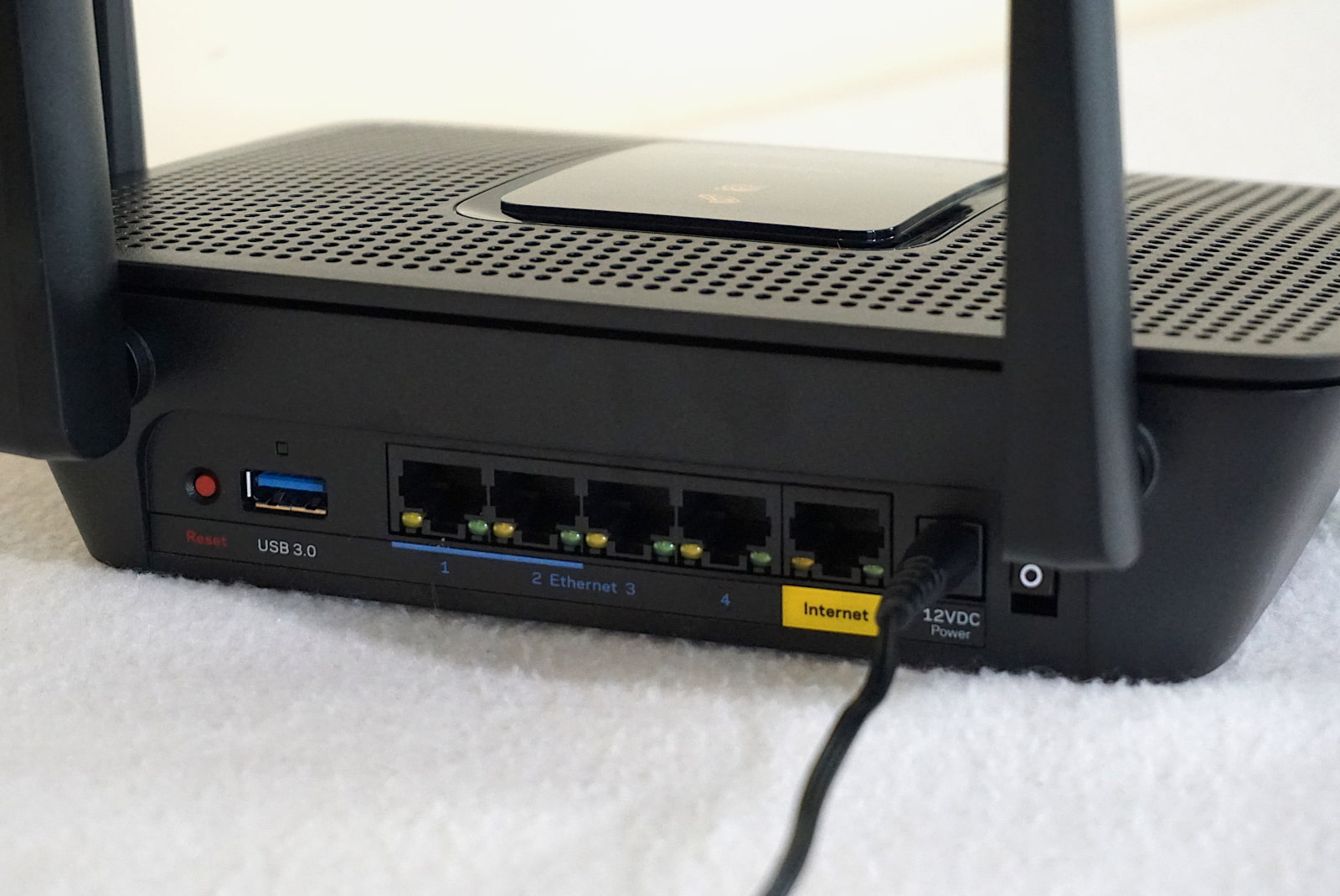 Linksys-EA8300-ports-and-buttons Rear of Linksys EA8300 router showing ethernet ports and USB port