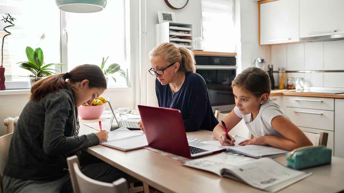 family working at kitchen island