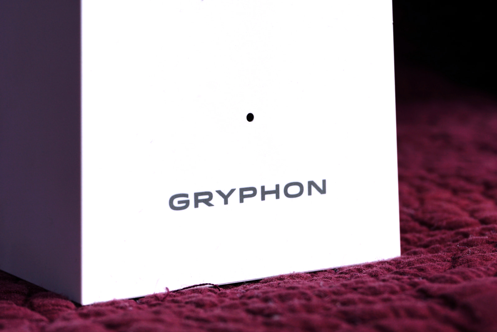 Close up of Gryphon logo and LED light on front of router