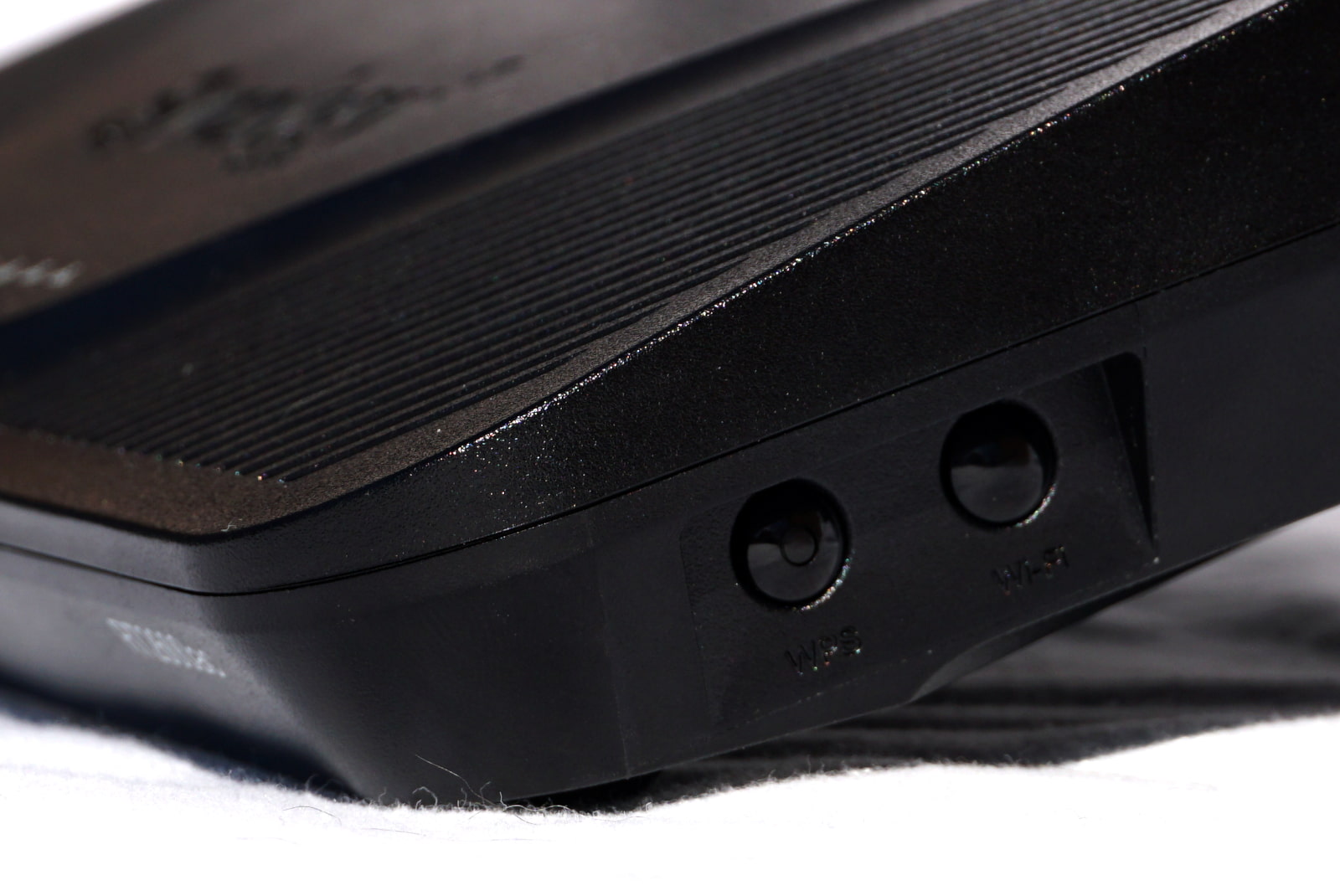 synology-rt2600ac-wifi-button Wi-Fi button on side of Synology RT2600ac router