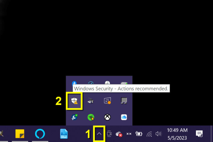 Access the hidden icons with the up arrow on the right side of the taskbar on Windows 10
