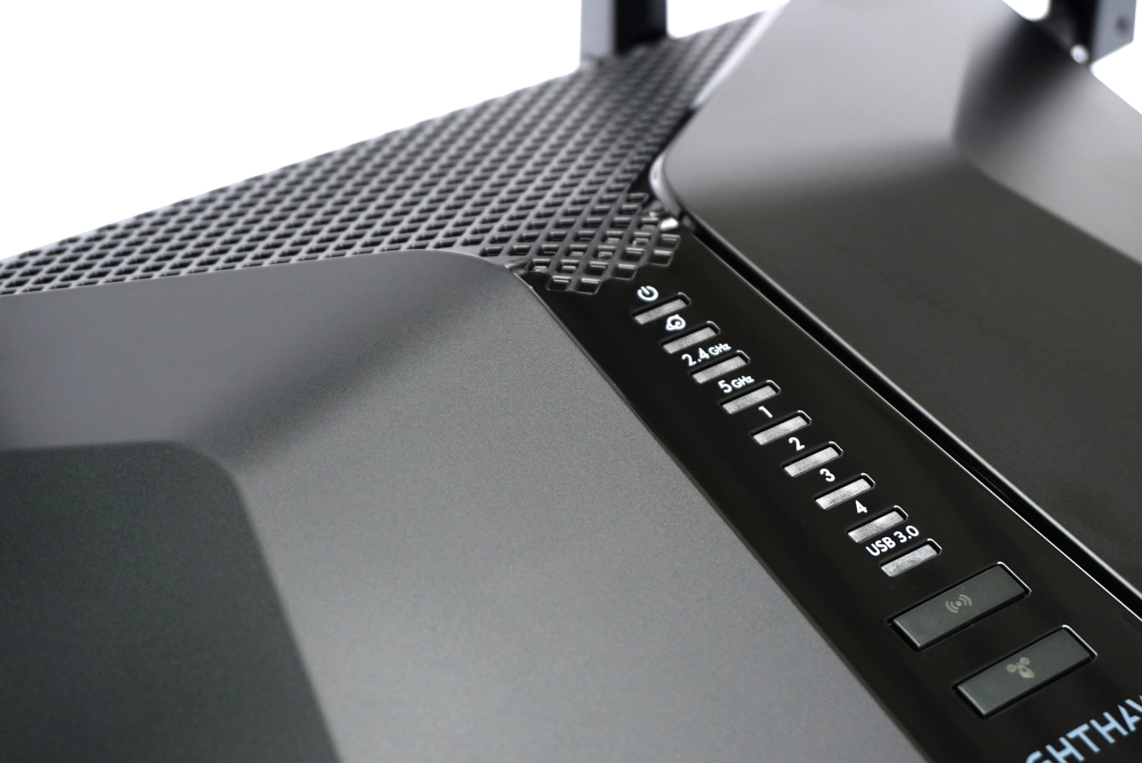 netgear-nighthawk-rax50-buttons Up close image of indicator lights and buttons on Nighthawk RAX50