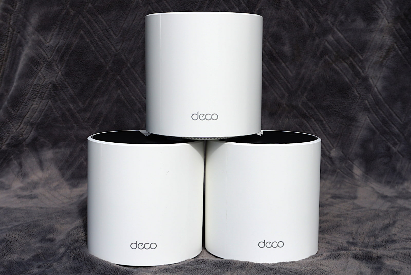 tplink-deco-x55-pro-stack-front Three Deco X55 Pro router units stacked