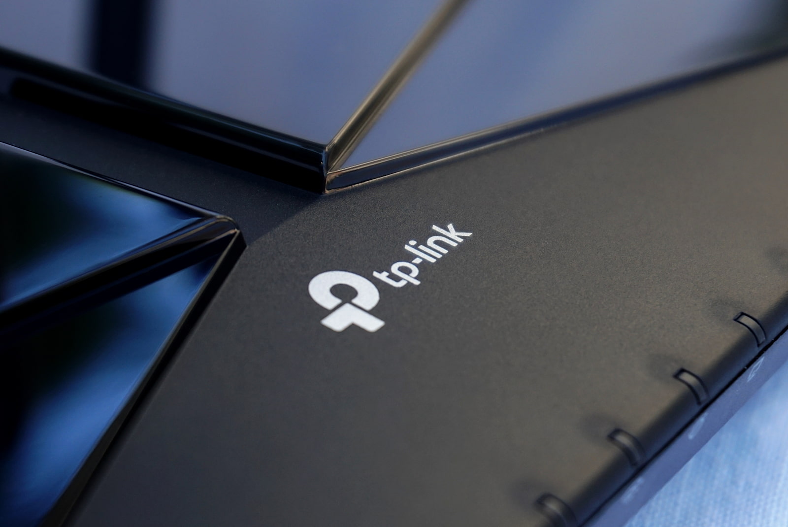 close up shot of tp-link logo on archer ax3000