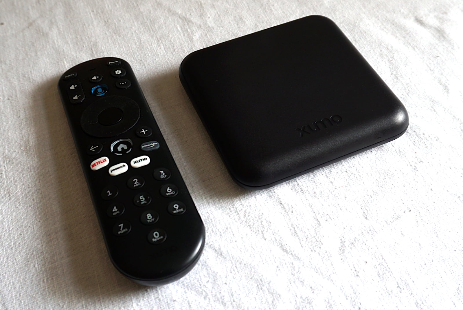 angled shot of Xumo Stream Box and remote