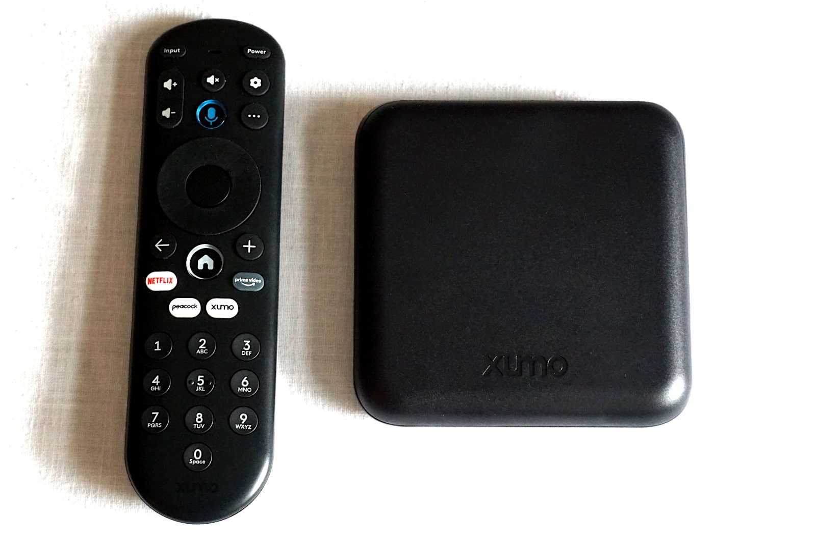 photo of Xumo Stream Box and remote from above