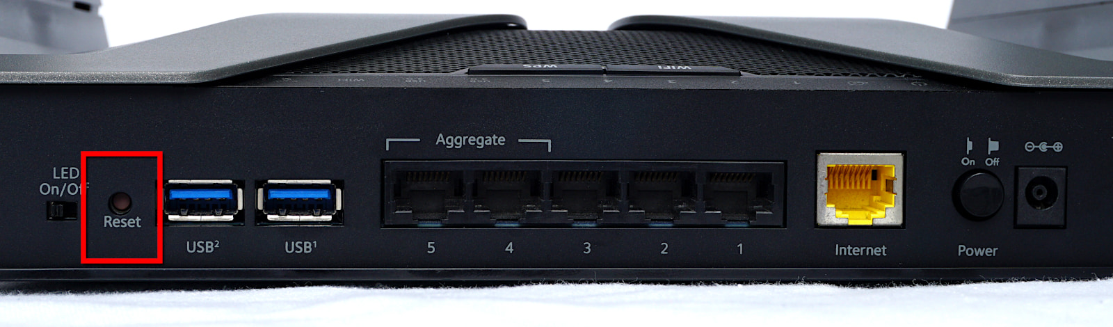 Reset button on left hand side of rear of NETGEAR router