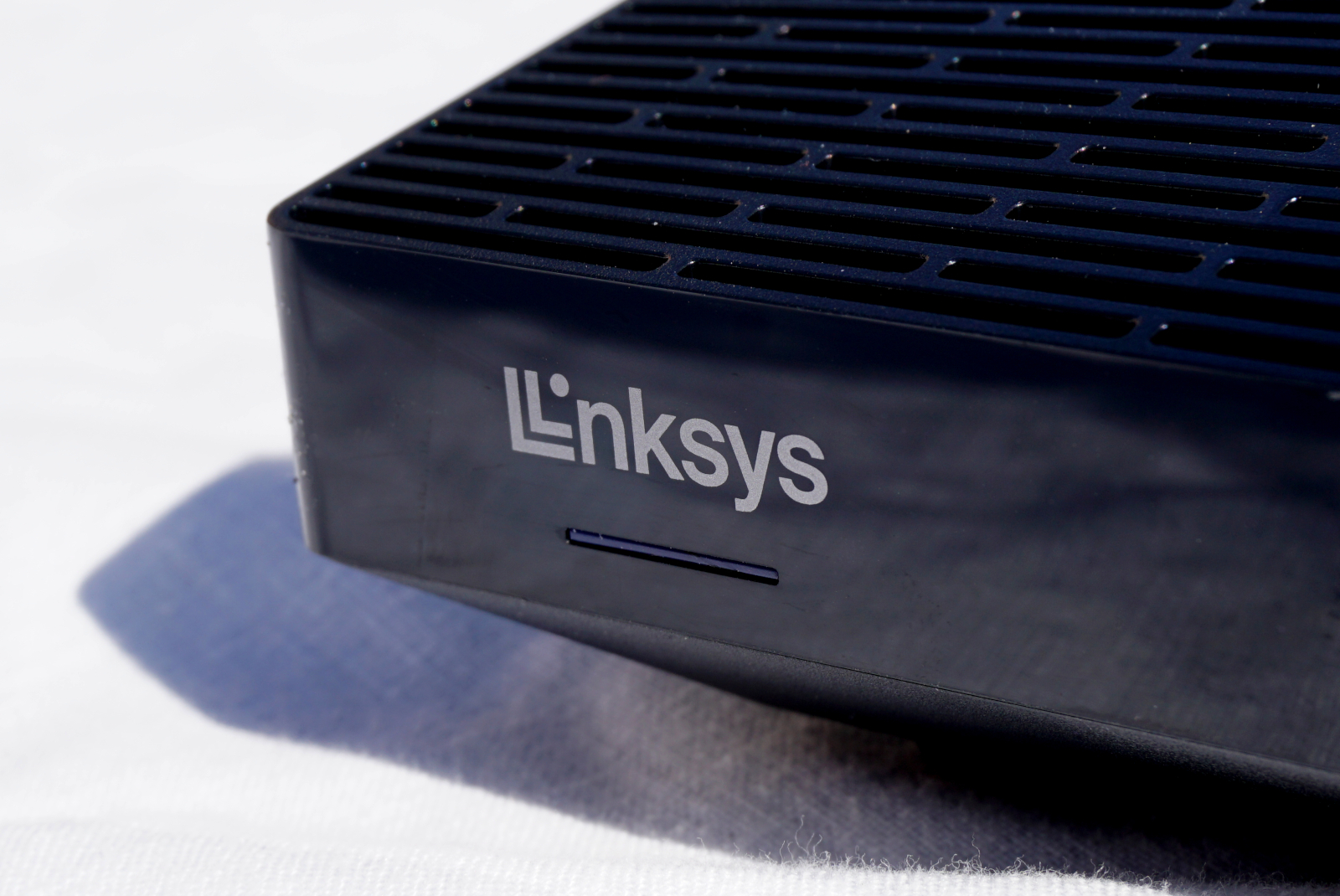 Close up of Linksys Hydra Pro 6 router logo