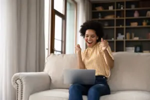 woman celebrates good deal on home internet