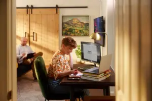 Woman working at desk with a computer