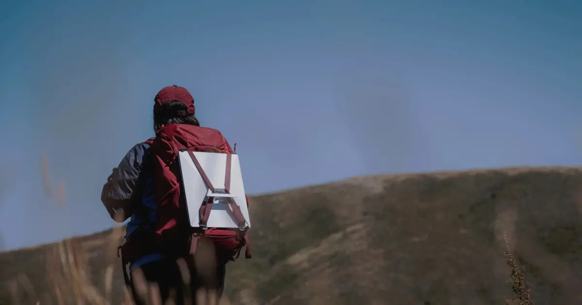 spacex-starlink-mini-dish-backpack Man carries Starlink Mini dish in backpack