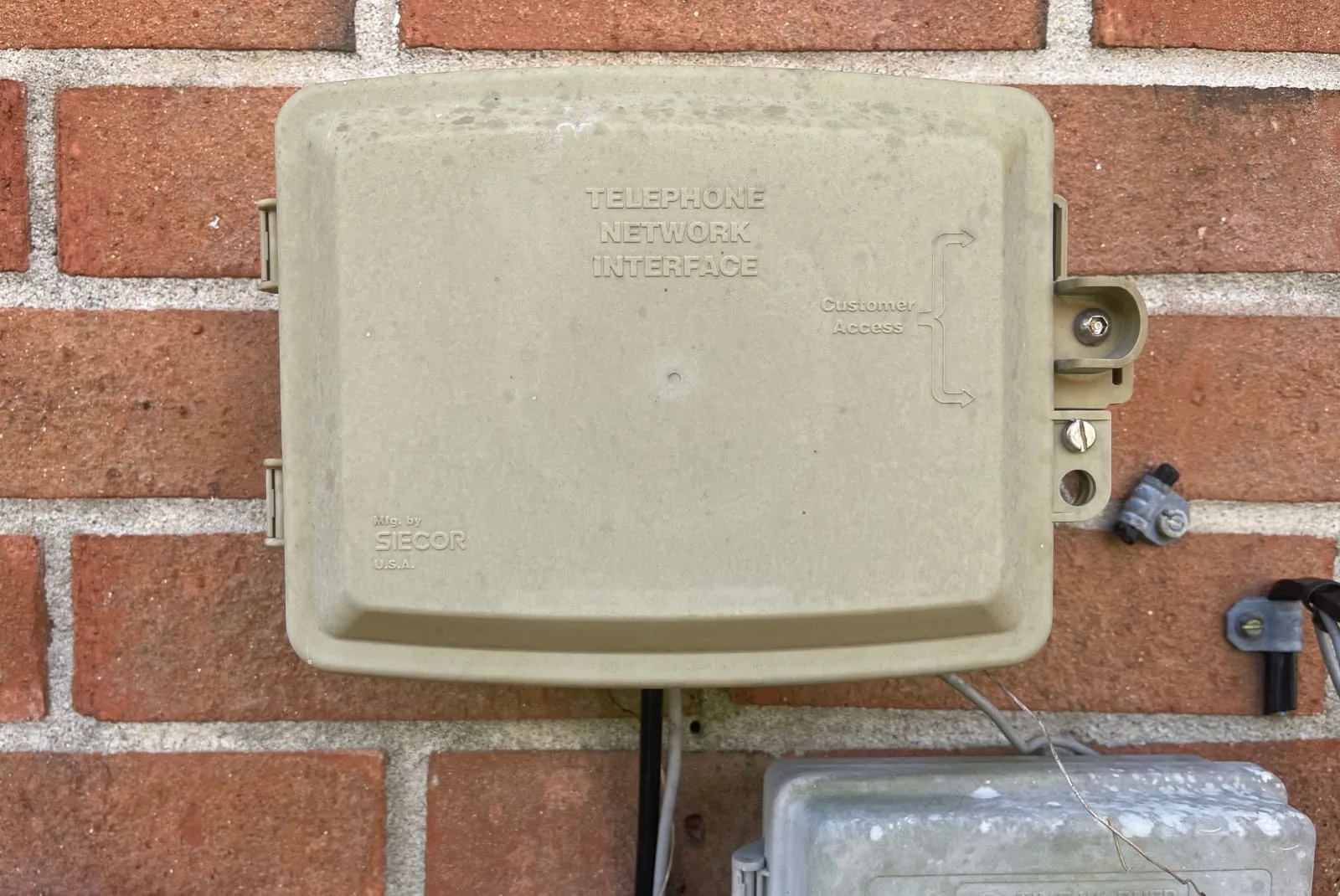 dsl-connection-service-box DSL connection service box against brick wall