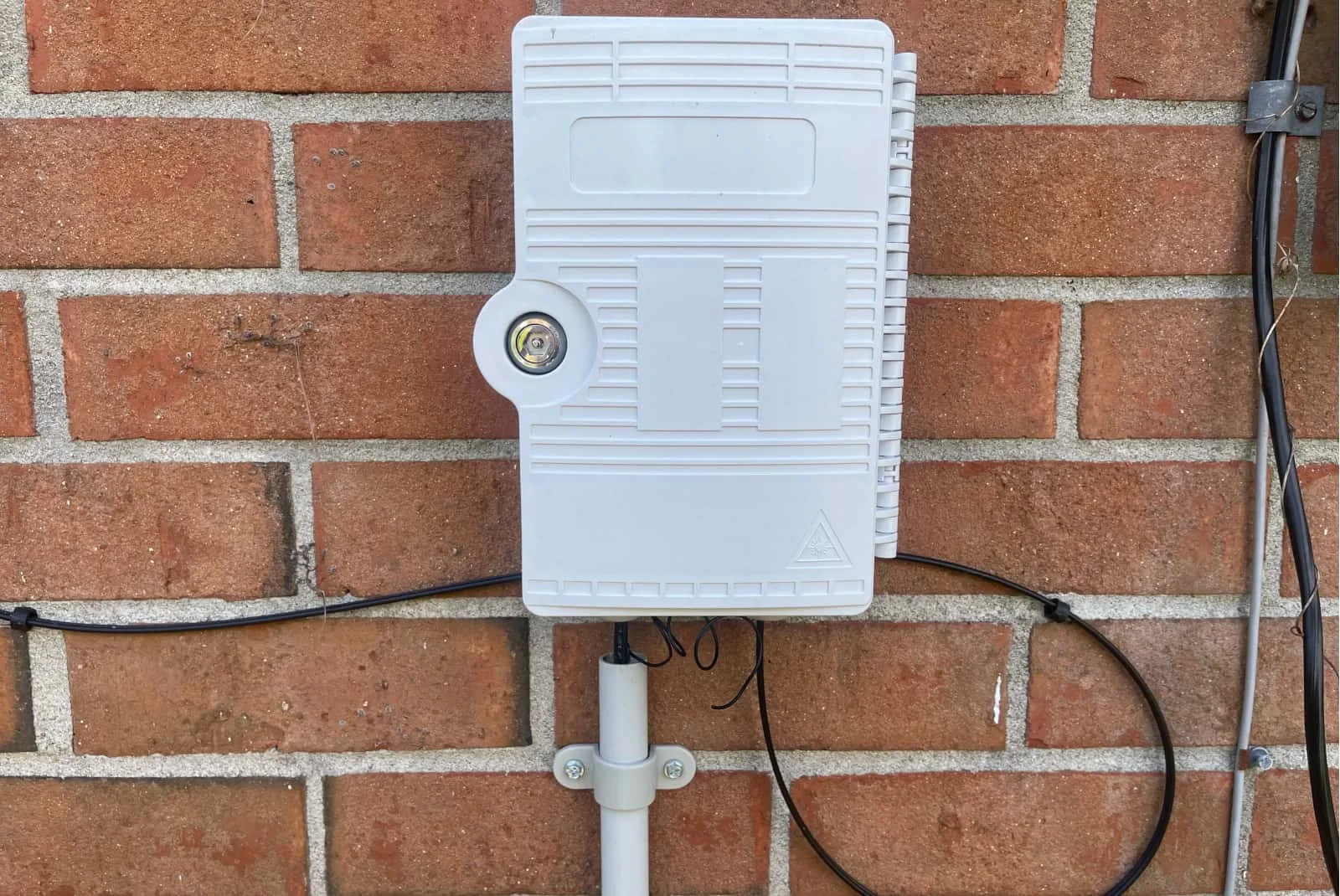 fiber-internet-service-box Fiber internet service box against brick wall