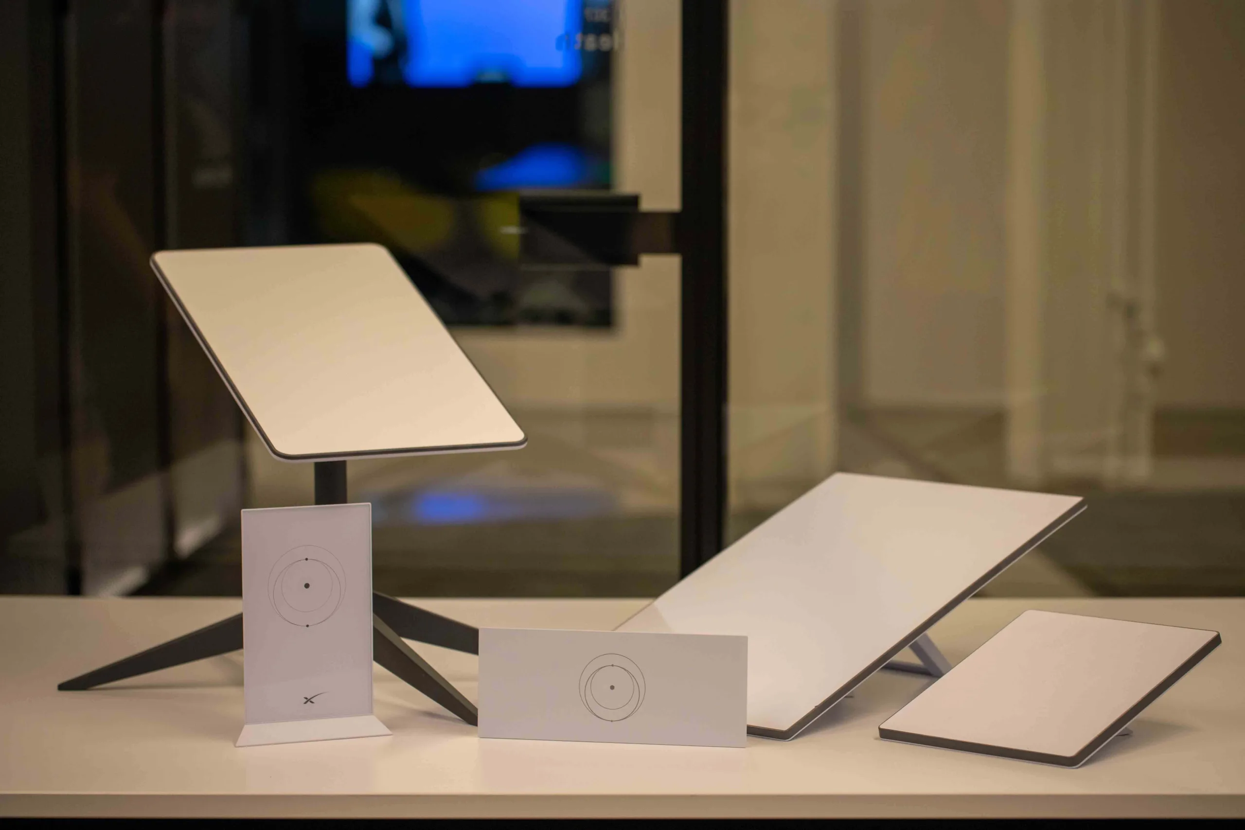 Three versions of Starlink equipment, including two standard dishes and the Starlink Mini.