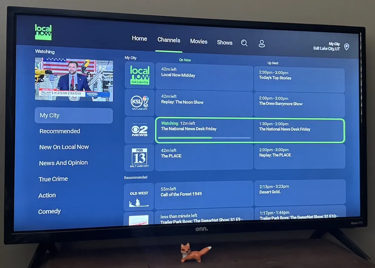 Photo of the Local Now app on a TV, listing local news channels.